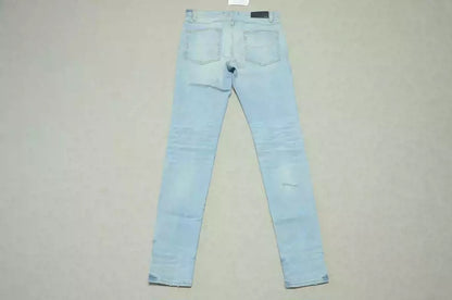 Amiri Blue washed knife cuts and damages jeans and casual pants