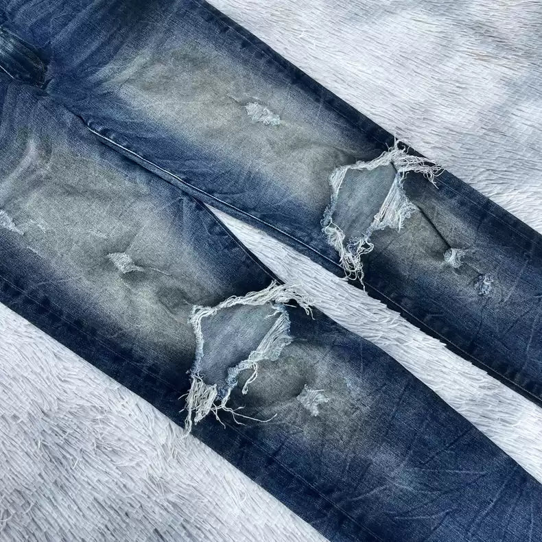 Amiri oil stains, metal washings, worn knees, damaged jeans