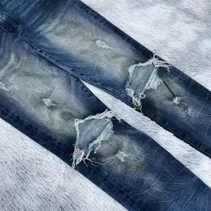 Amiri oil stains, metal washings, worn knees, damaged jeans