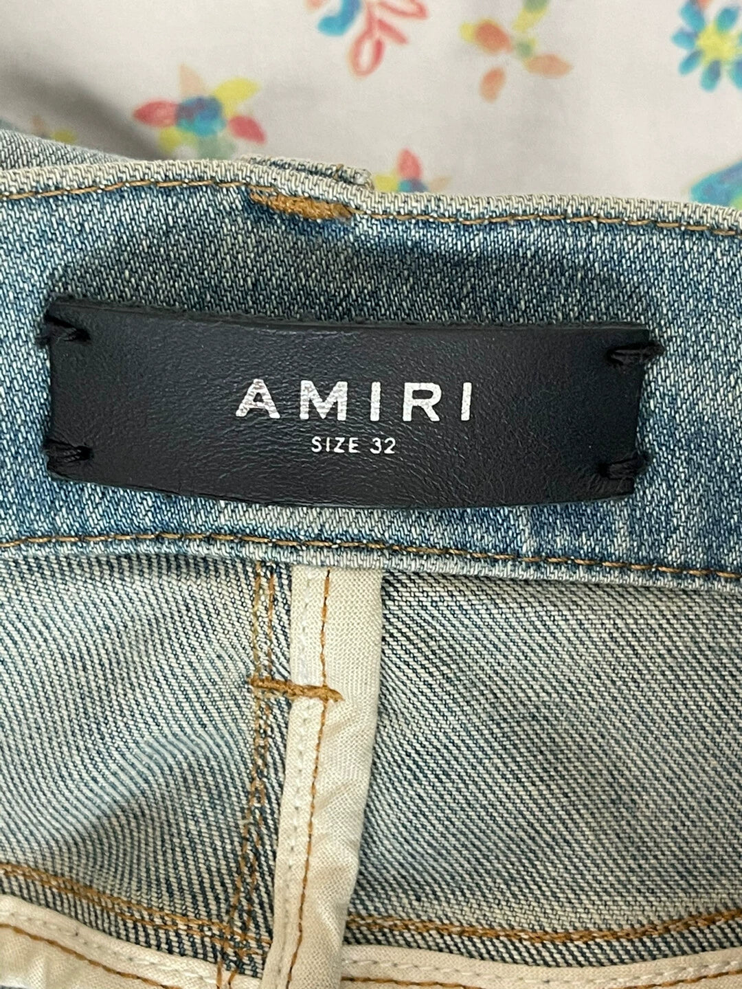 AMIRI side stripe perforated elastic slim fit jeans