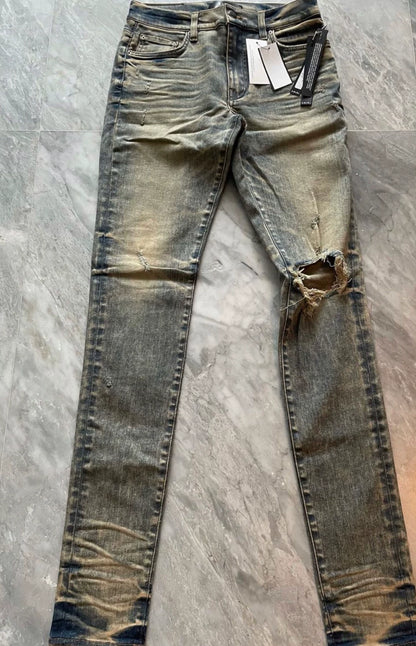 Amiri classic yellow mud washed single torn jeans