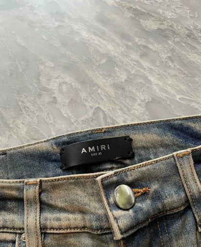 Amiri classic yellow mud washed single torn jeans