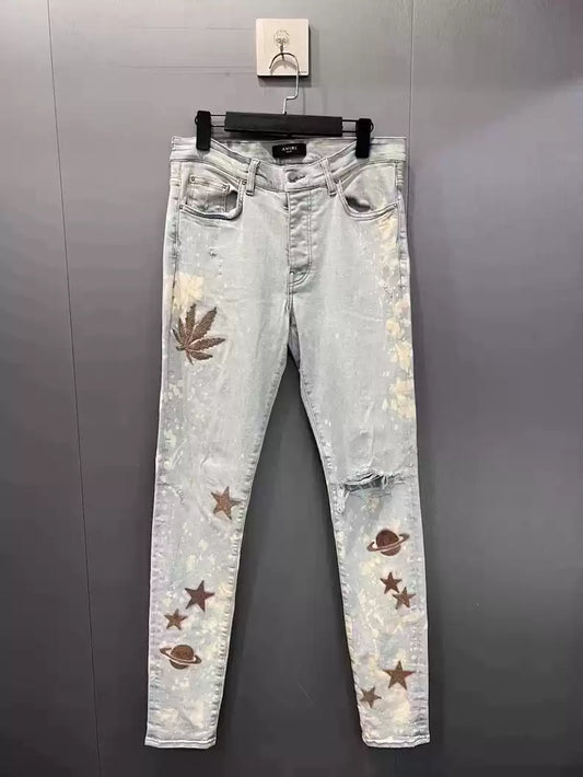 Amiri splashed maple leaf plush washed ice blue jeans