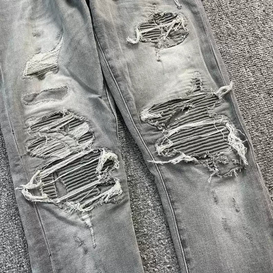 Amiri destroys patchwork jeans