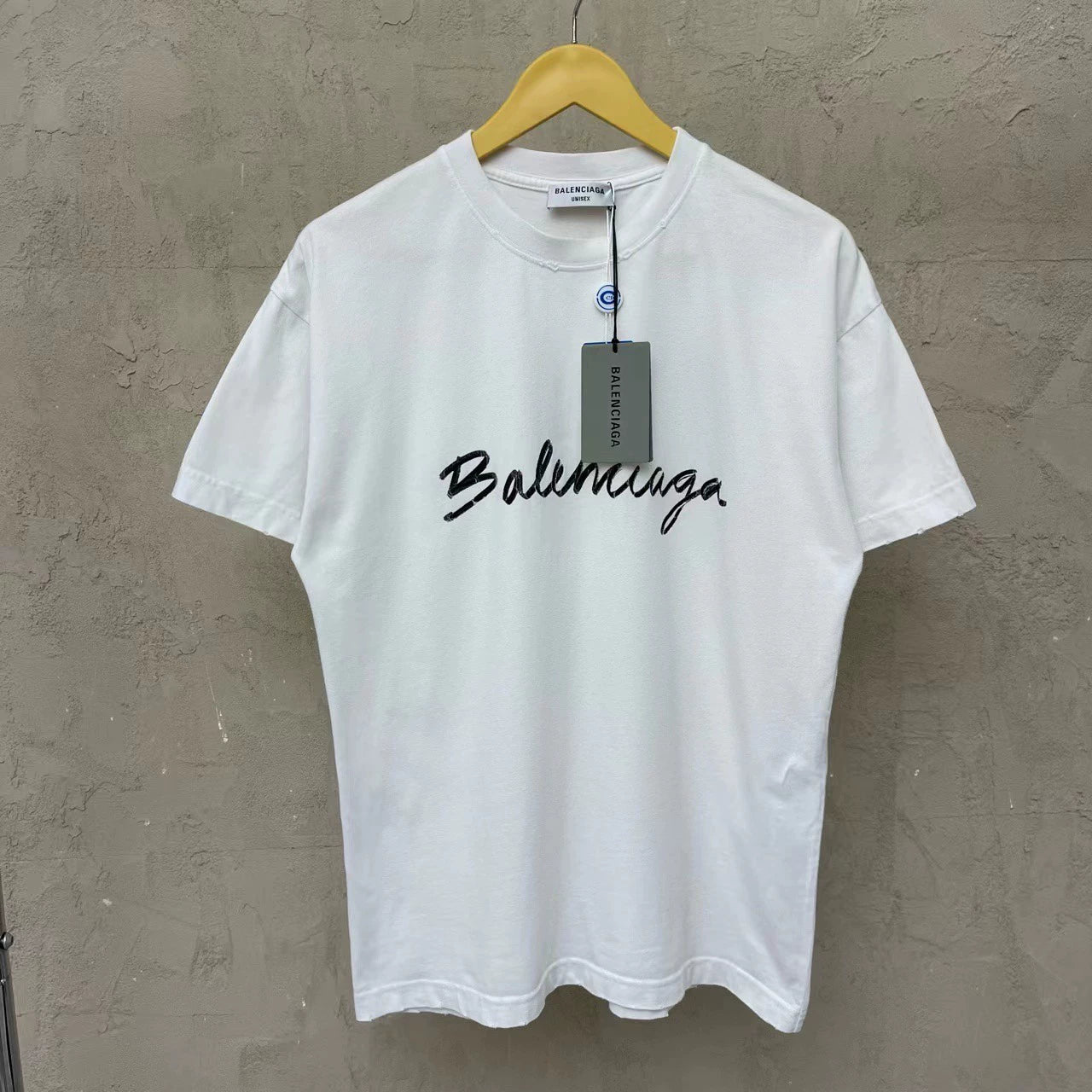 Balenciaga white cursive logo is damaged and worn short sleeved