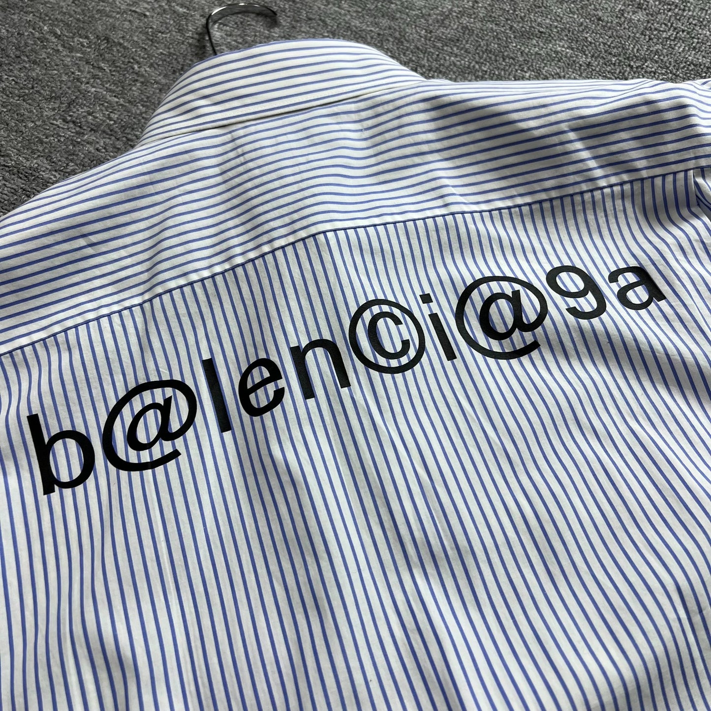 Balenciaga small logo on the chest and email shirt on the back