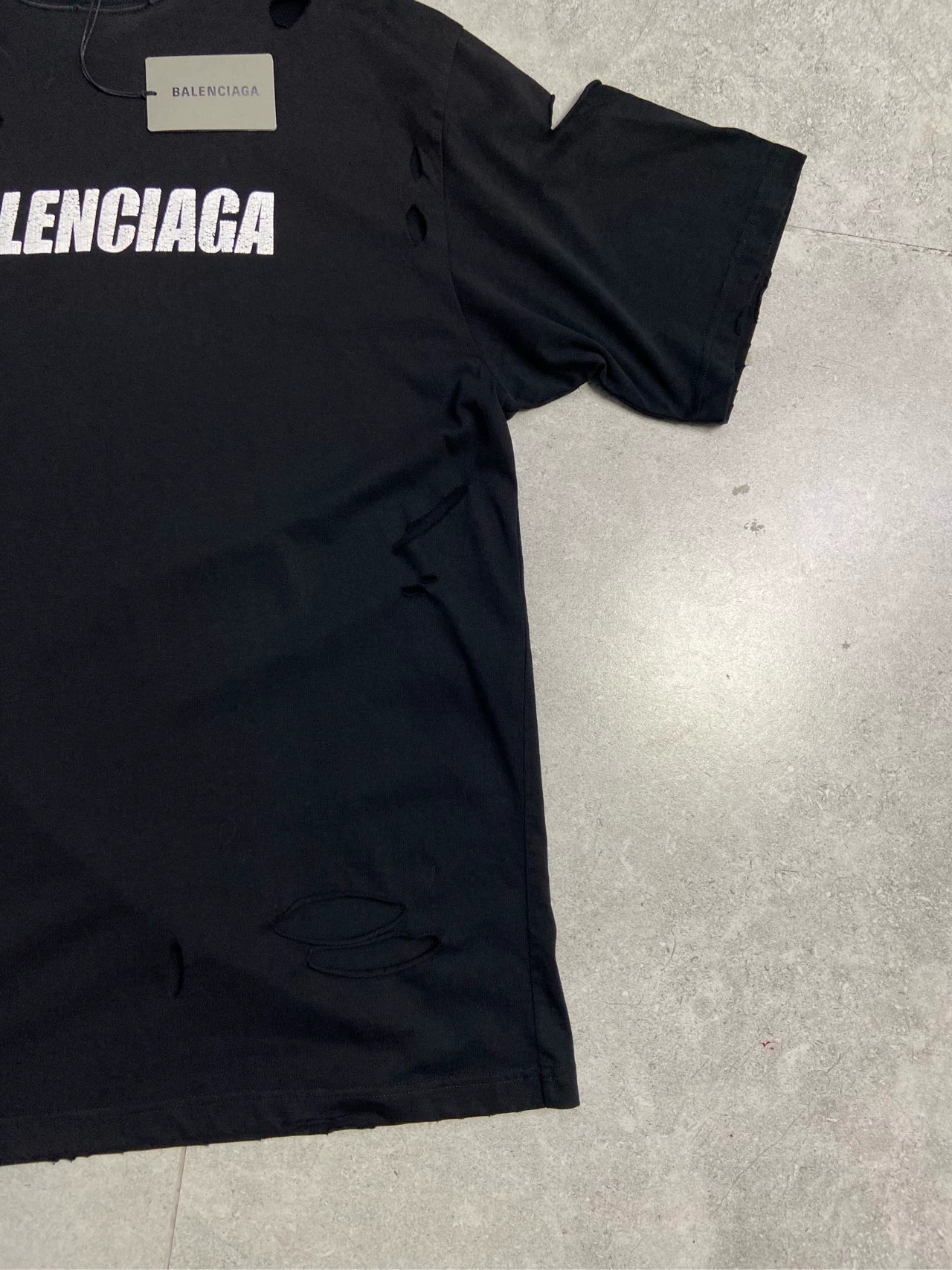 Balenciaga destroys logo cracks short sleeves