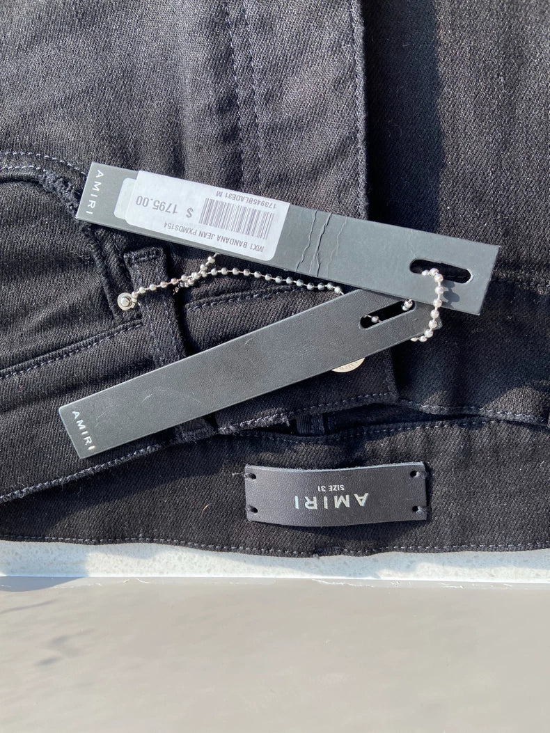 Amiri MX1 Bandana Jeans with Ripped Design