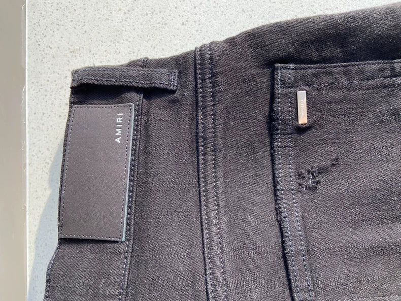 Amiri MX1 Bandana Jeans with Ripped Design