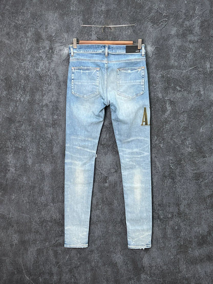 AMIRI Distressed Logo Embroidered Jeans