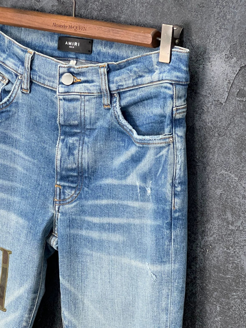AMIRI Distressed Logo Embroidered Jeans
