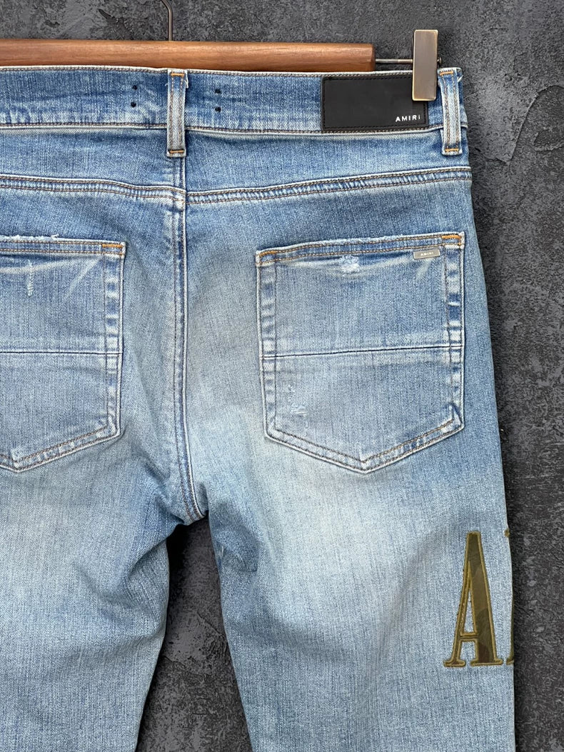 AMIRI Distressed Logo Embroidered Jeans