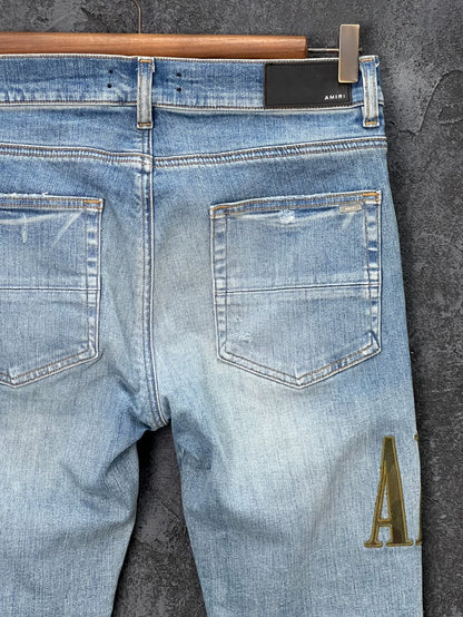 AMIRI Distressed Logo Embroidered Jeans