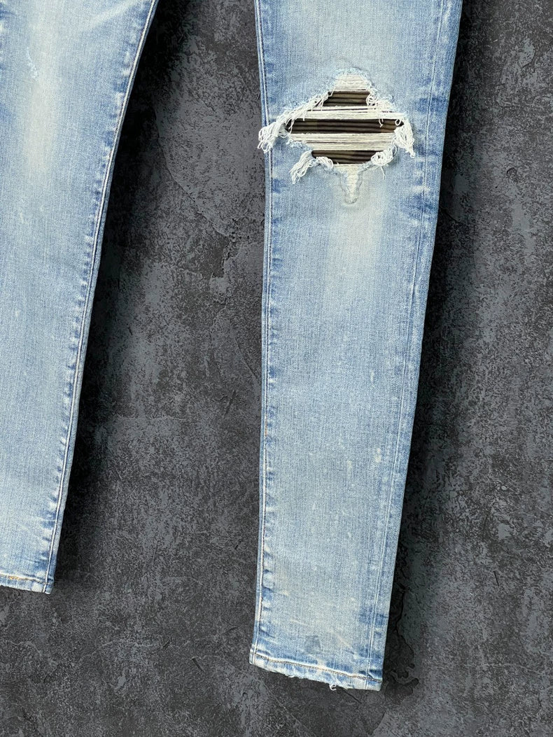 AMIRI Distressed Logo Embroidered Jeans
