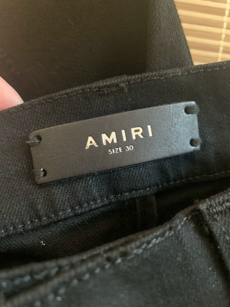 Amiri Black Denim Pants with Artistic Patchwork