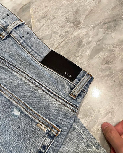 Amiri Light Blue Denim Pants with Distressing