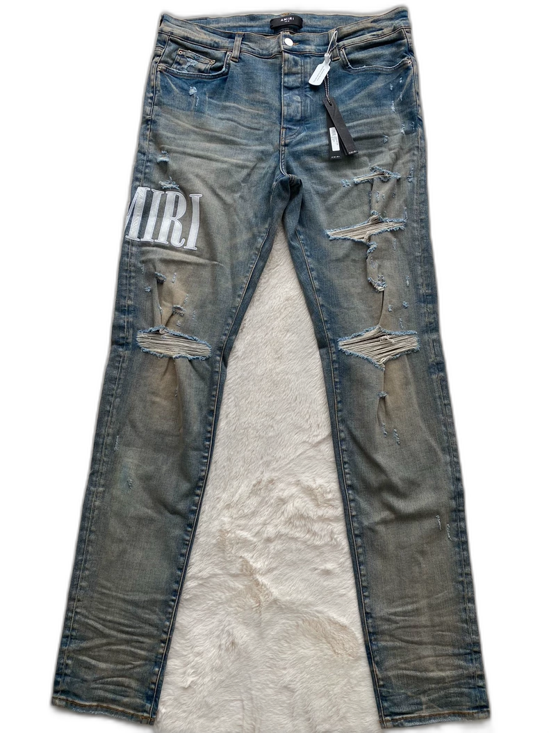 Amiri Logo Patch Distressed Denim Pants