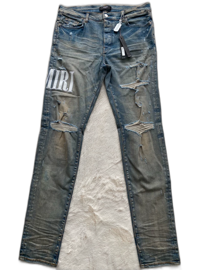 Amiri Logo Patch Distressed Denim Pants