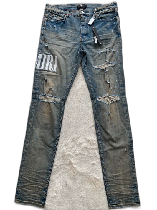 Amiri Logo Patch Distressed Denim Pants