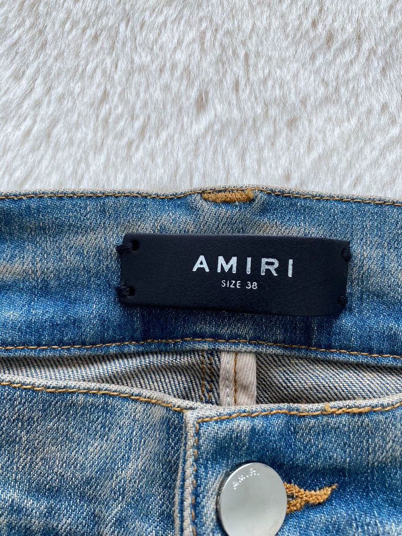 Amiri Logo Patch Distressed Denim Pants