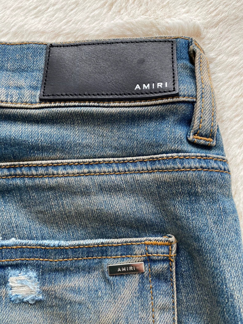 Amiri Logo Patch Distressed Denim Pants