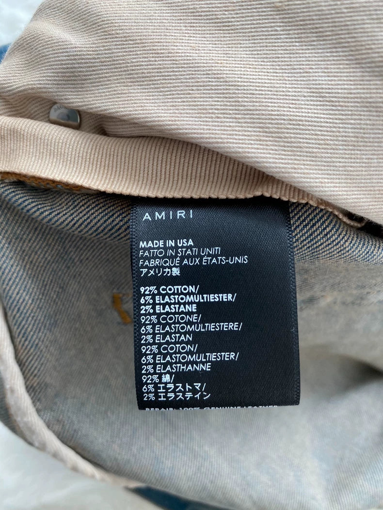 Amiri Logo Patch Distressed Denim Pants