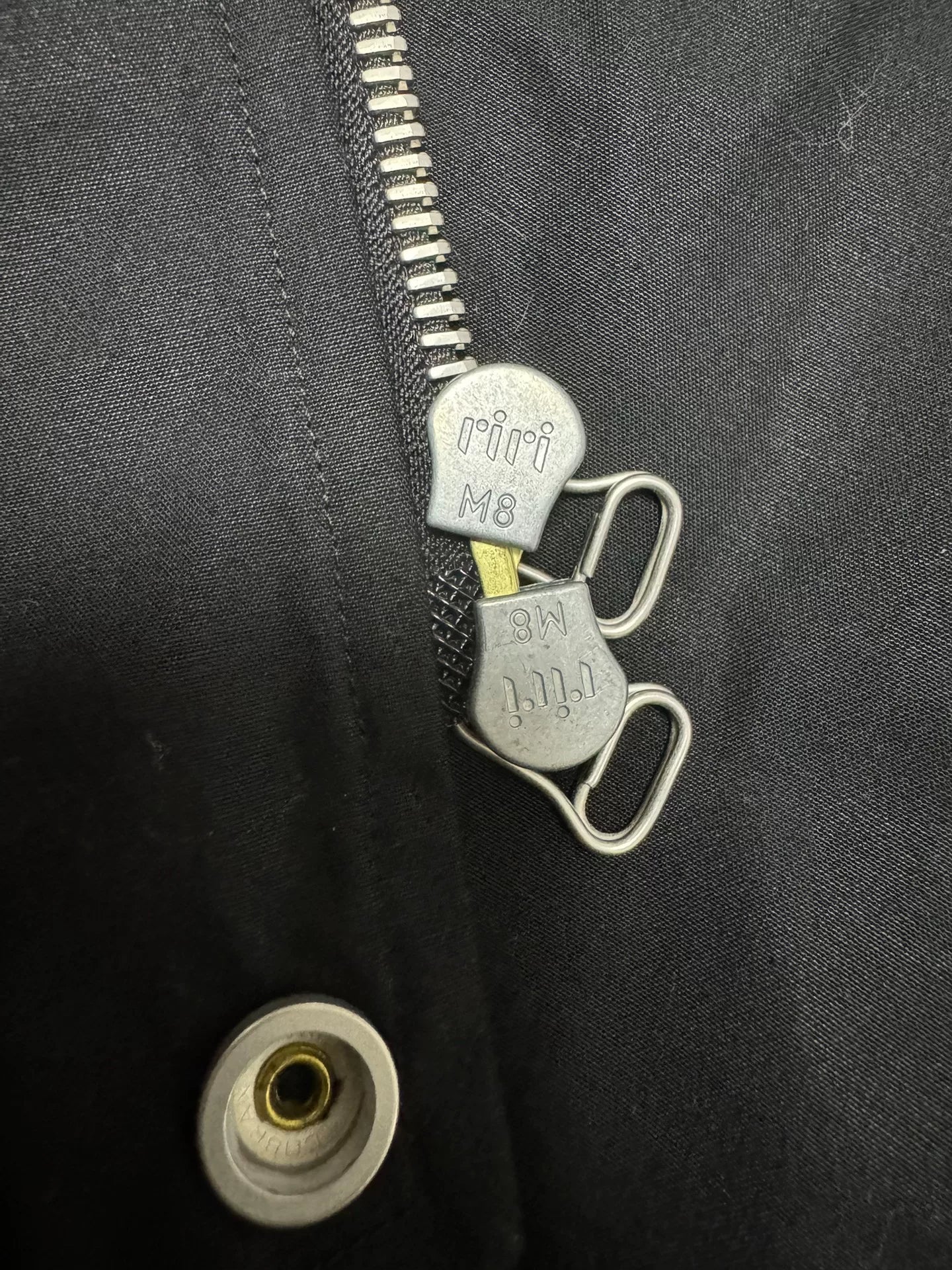 black bomber jacket with diagonal zipper