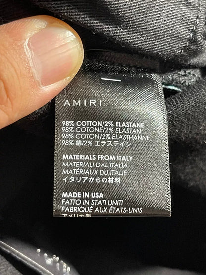 amiri watercolor half track jean