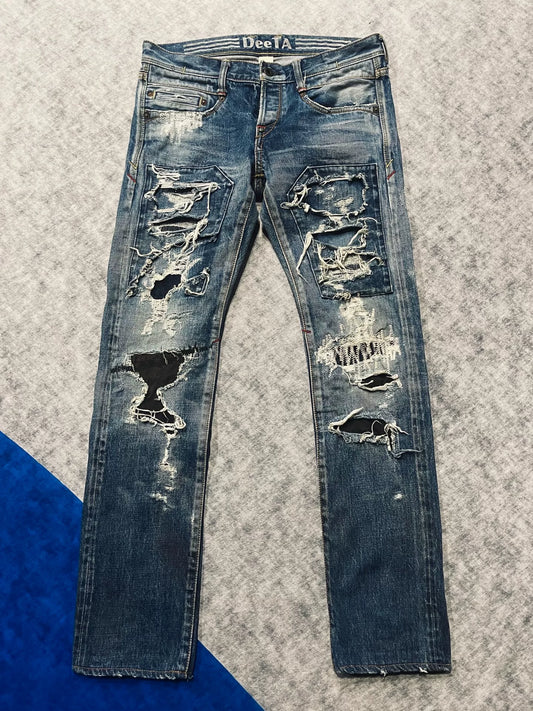 distressed low-rise blue denim jeans