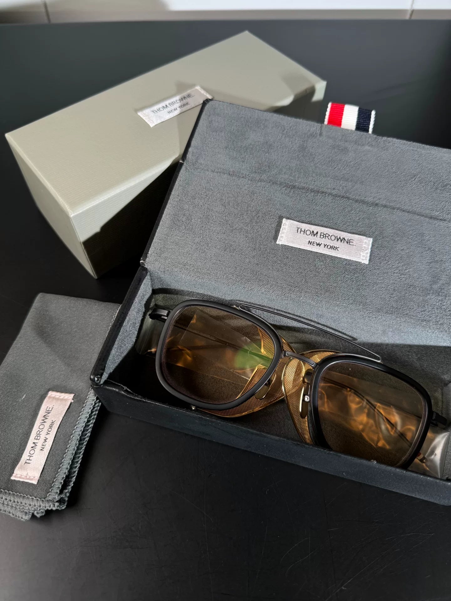 thom browne tb-808 sunglasses with gold accents