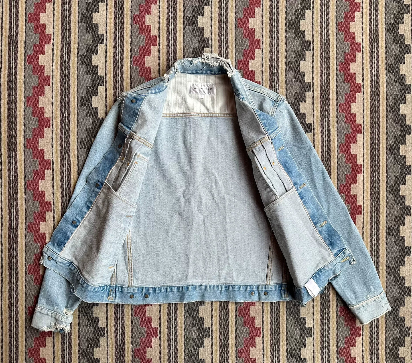 denim jacket with distressed details