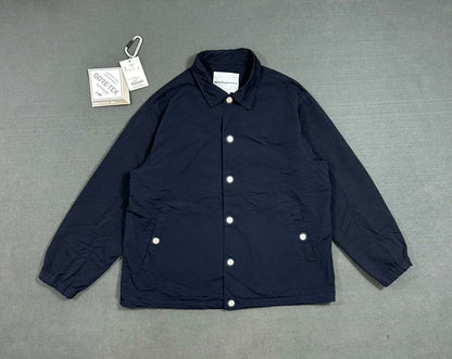 white mountaineering gore-tex coach jacket