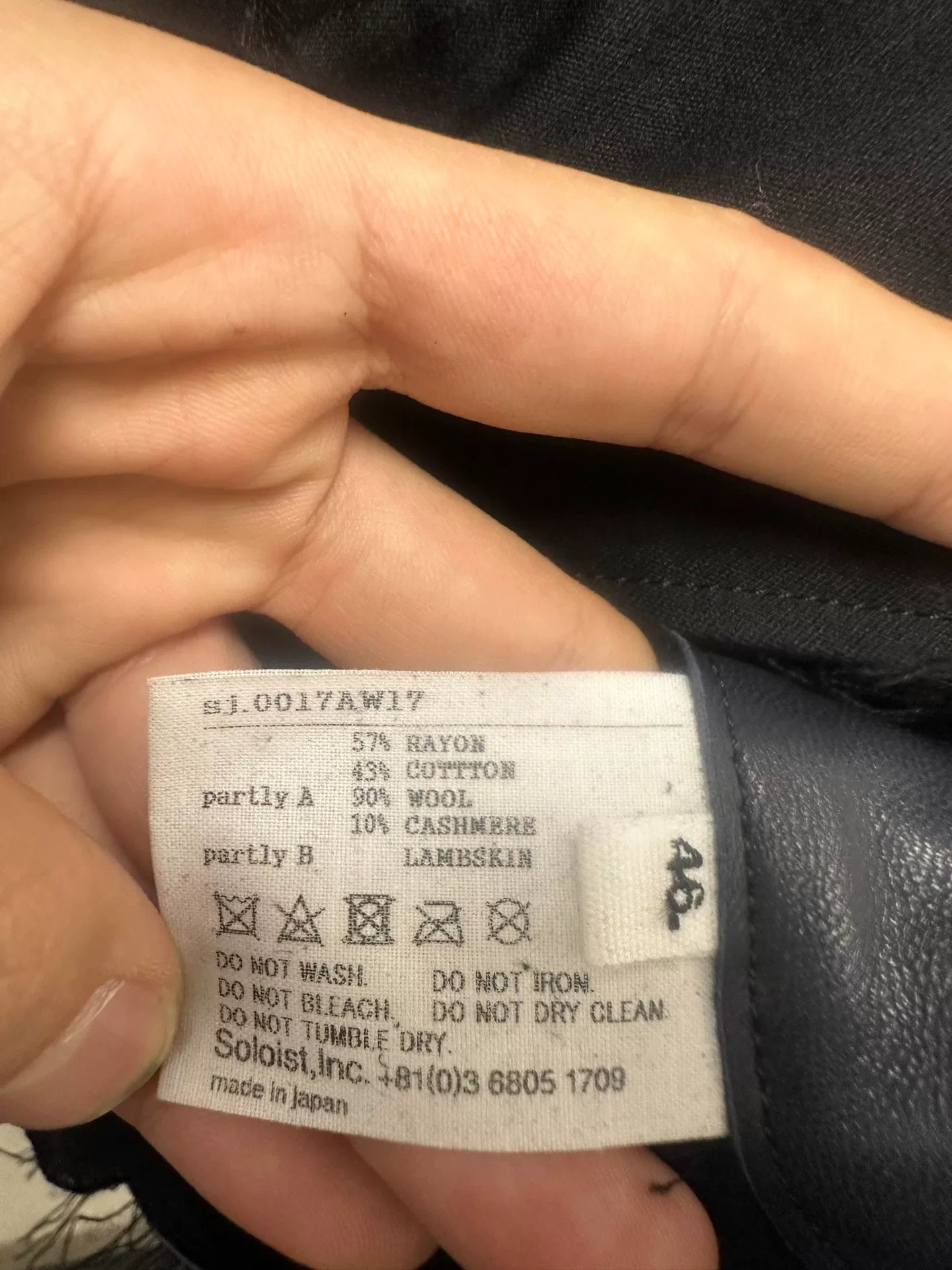 black oversized jacket with frayed hem