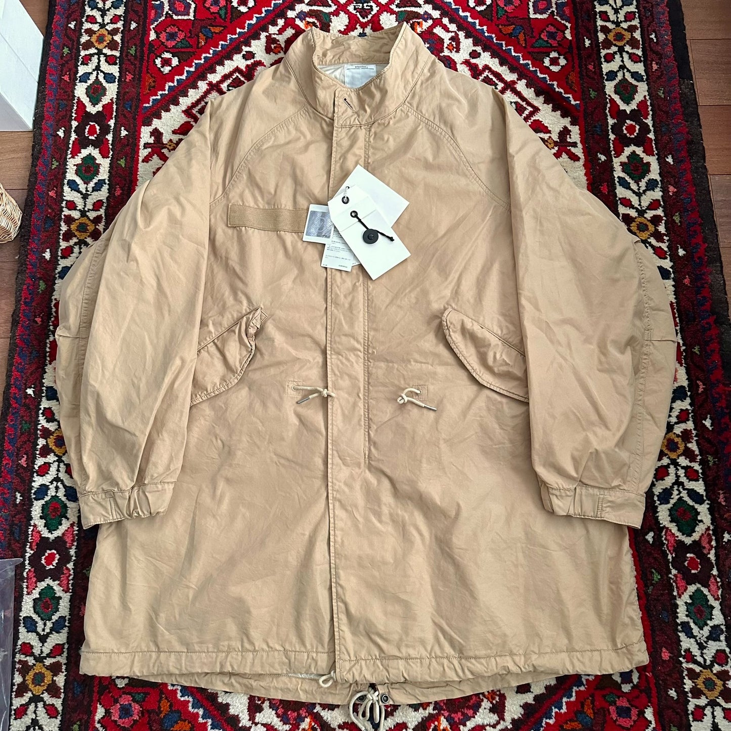 visvim m65 coat in beige color