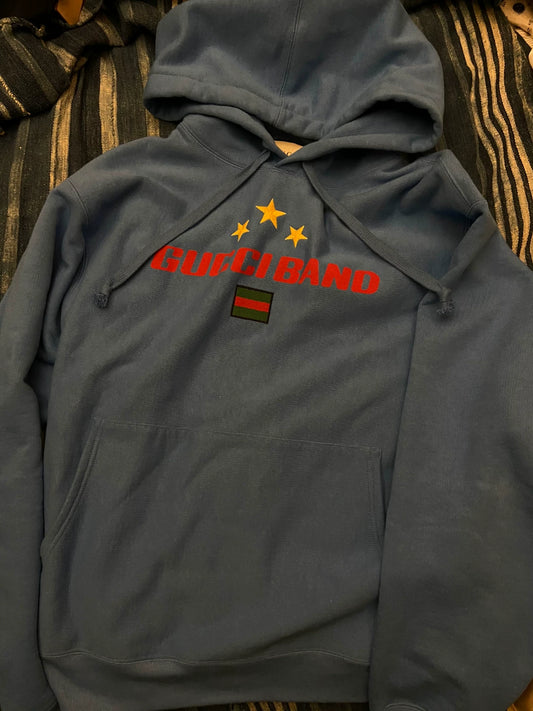 gucci blue hoodie with logo and stars
