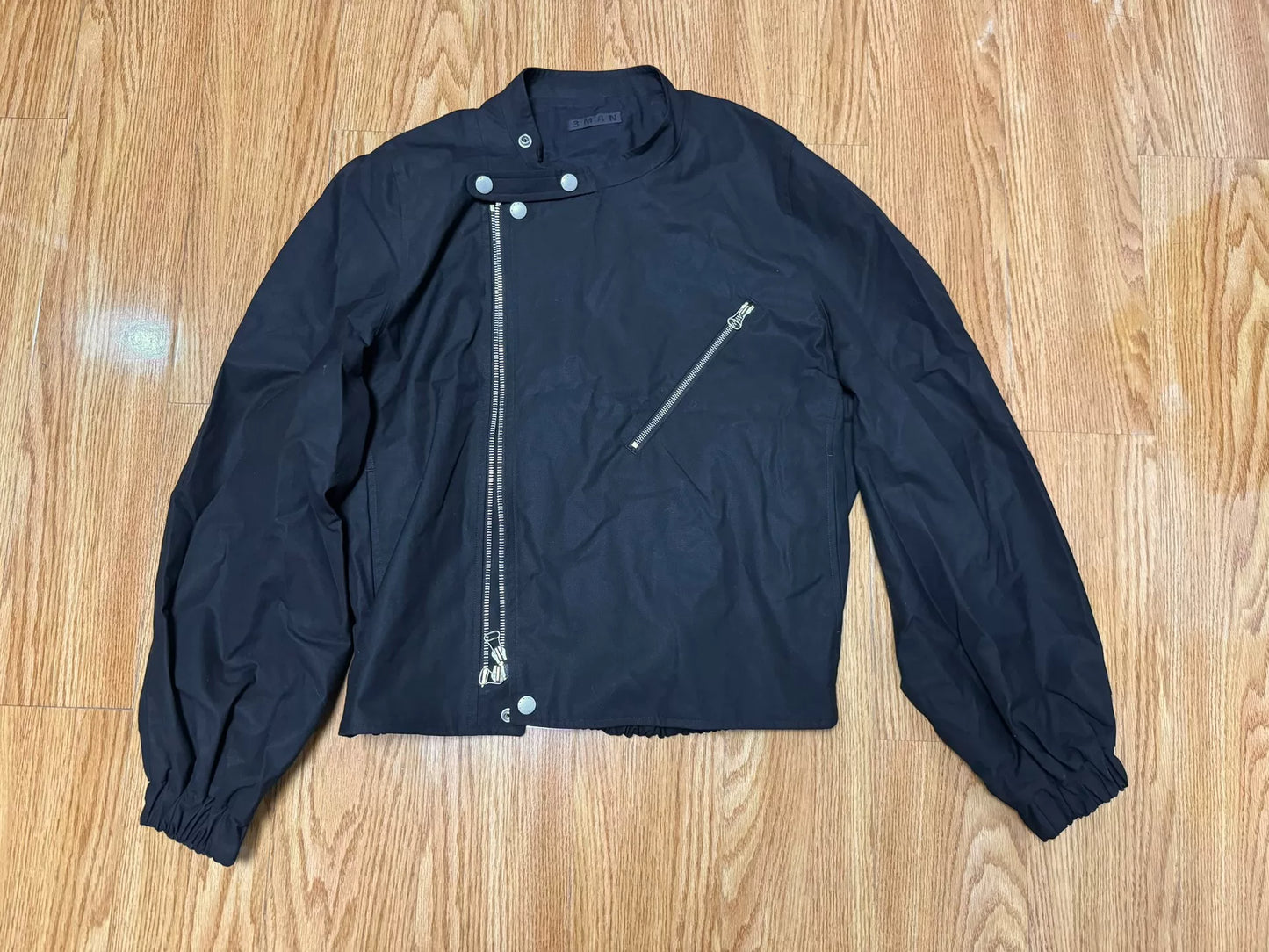 black bomber jacket with diagonal zipper