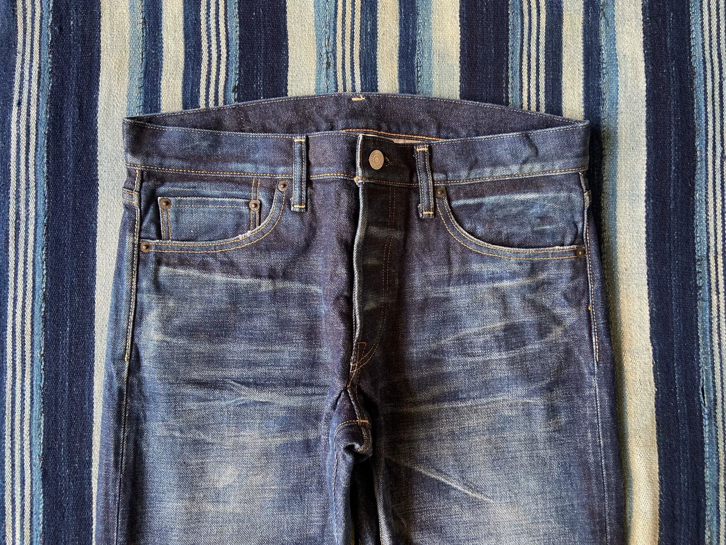 washed vintage-style raw denim jeans