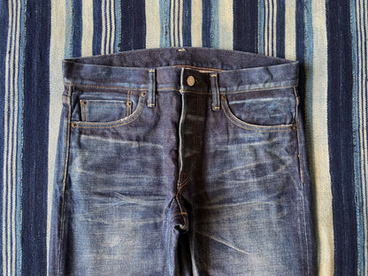 washed vintage-style raw denim jeans