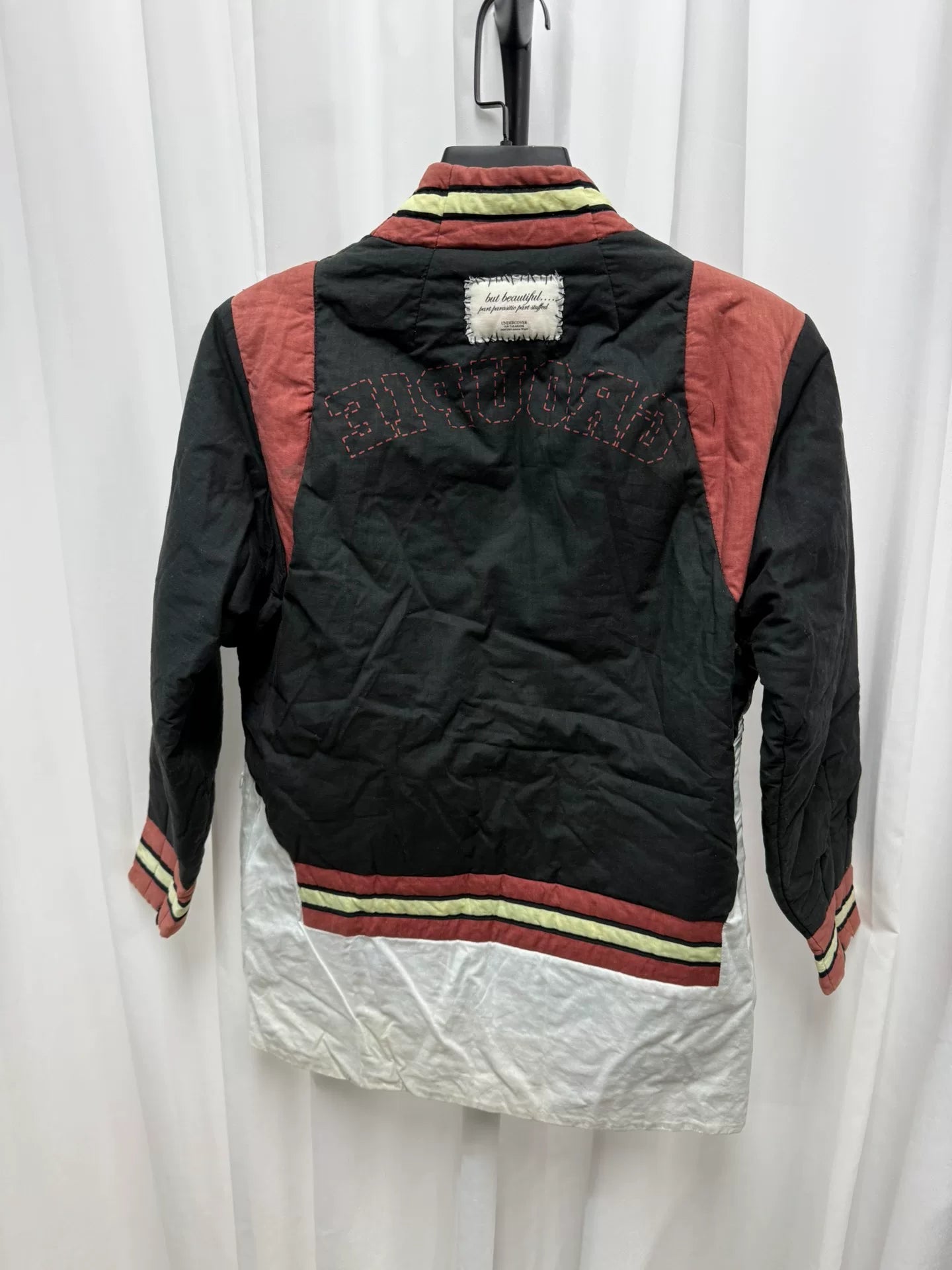 undercover bomber jacket with red accents