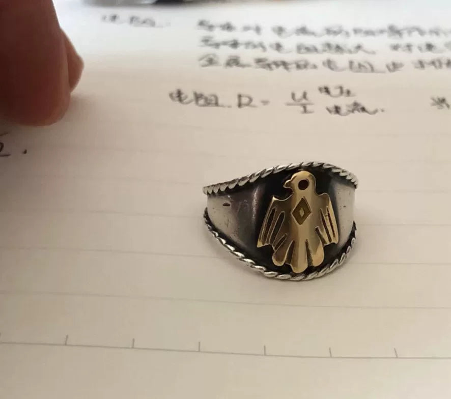 goros eagle ring with silver and gold details