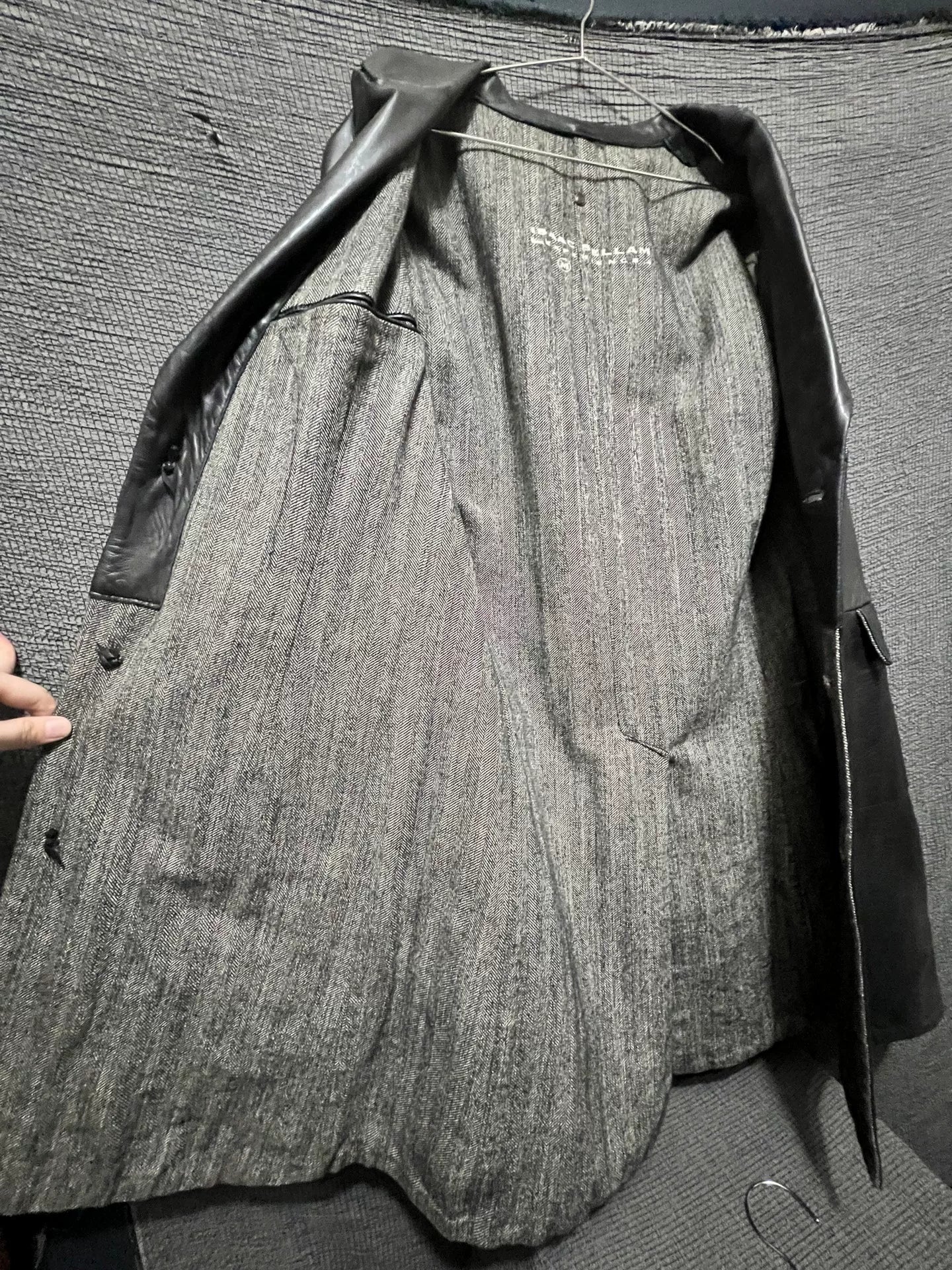 dark leather overcoat by isaac sellam experience