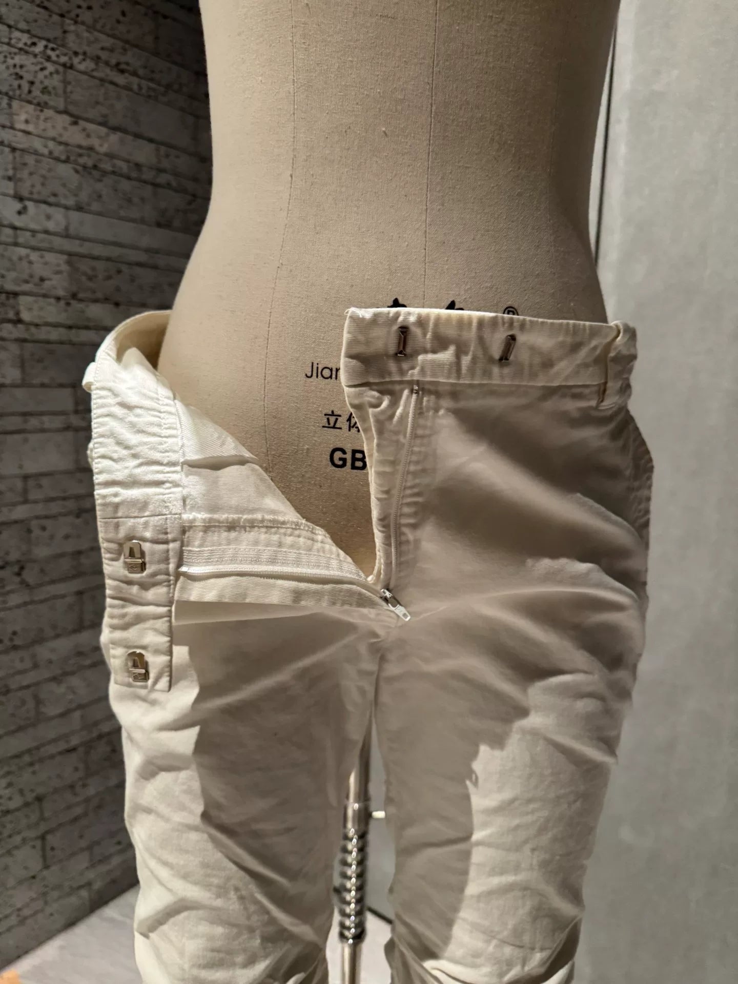 unique white pleated denim trousers