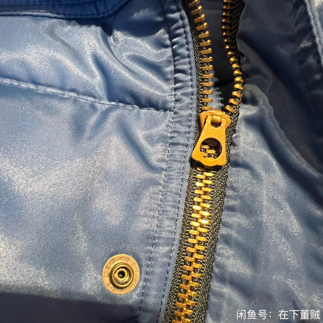 blue down vest by Tenderloin Tokyo