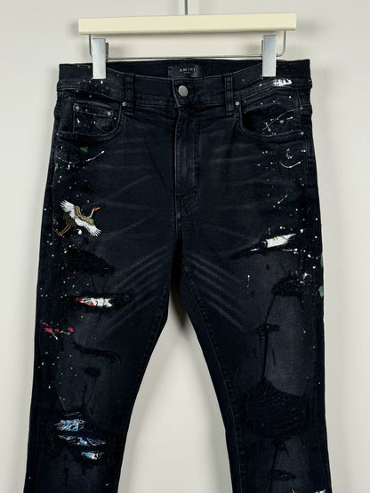 amiri crane graffiti embroidered distressed jeans