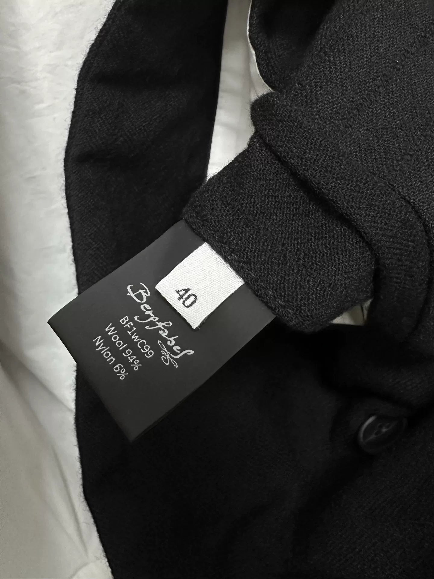 black double-breasted wool long coat