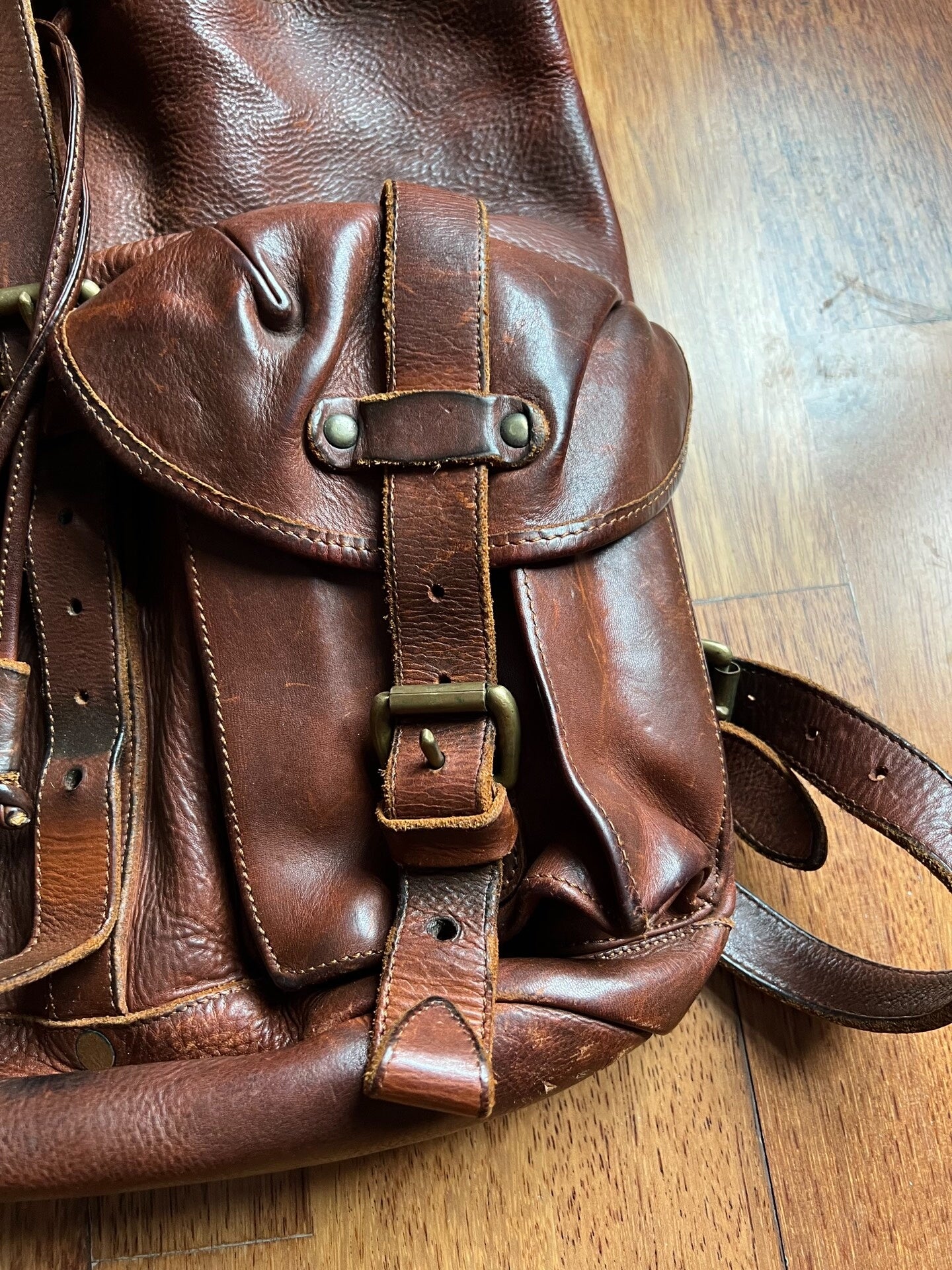 brown leather RRL backpack with pockets