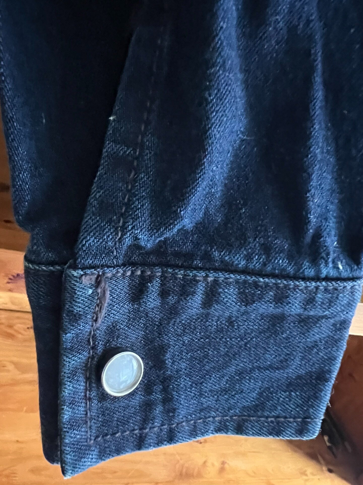 blue dyed work jacket with gem buttons