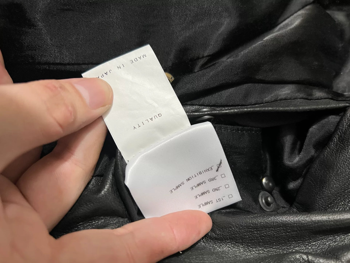 avant-garde leather jacket with metal elements