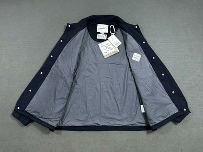 white mountaineering gore-tex coach jacket