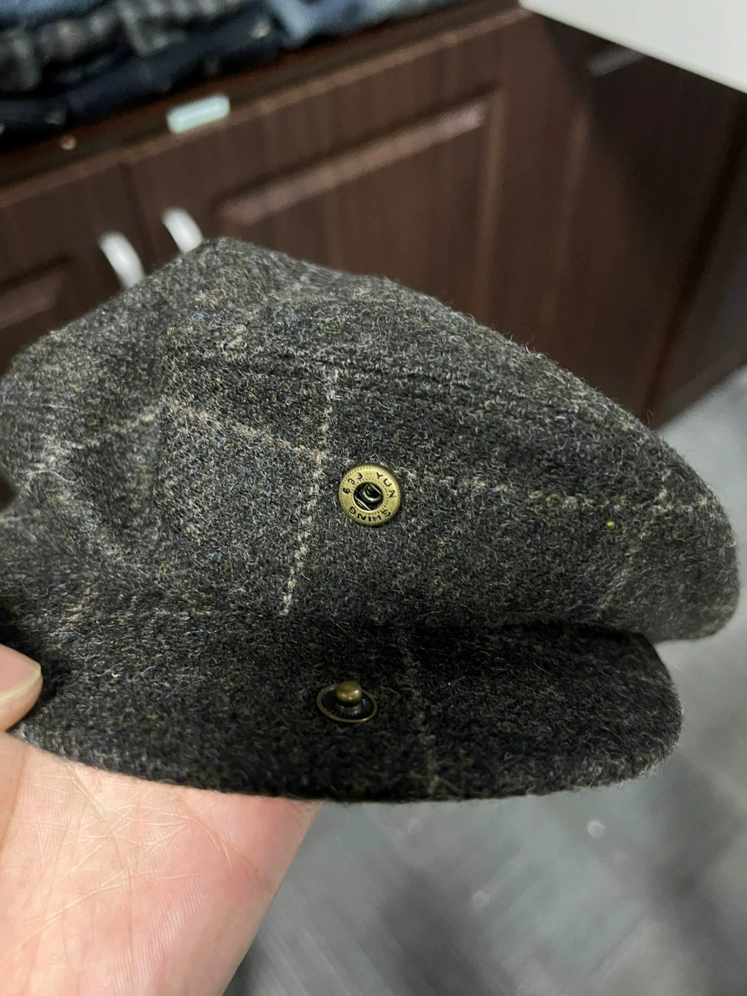 gray newsboy cap with plaid pattern